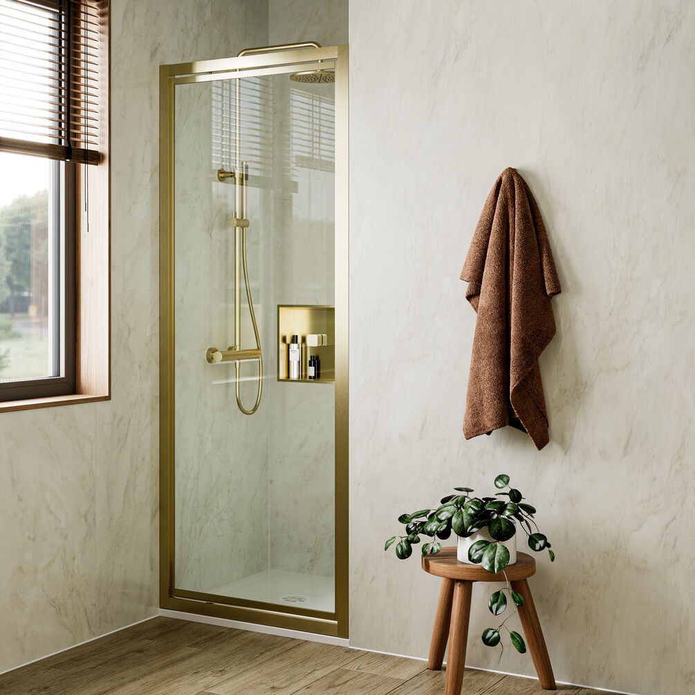 Lifestyle image of Crosswater Clear 6 Brushed Brass 900mm Pivot Shower Door